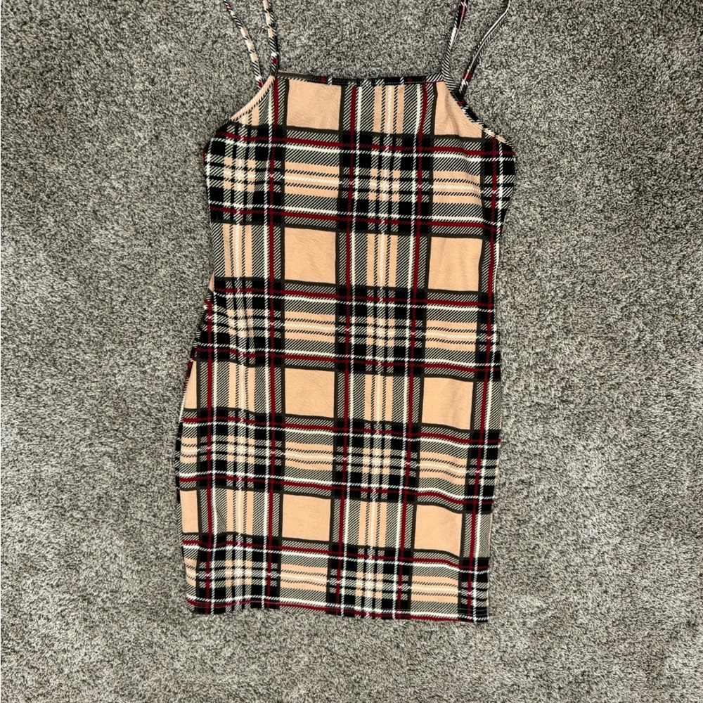 Pink, black, white and red plaid dress with spaghetti straps.